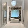 A bathroom with a large tub and walk in shower.