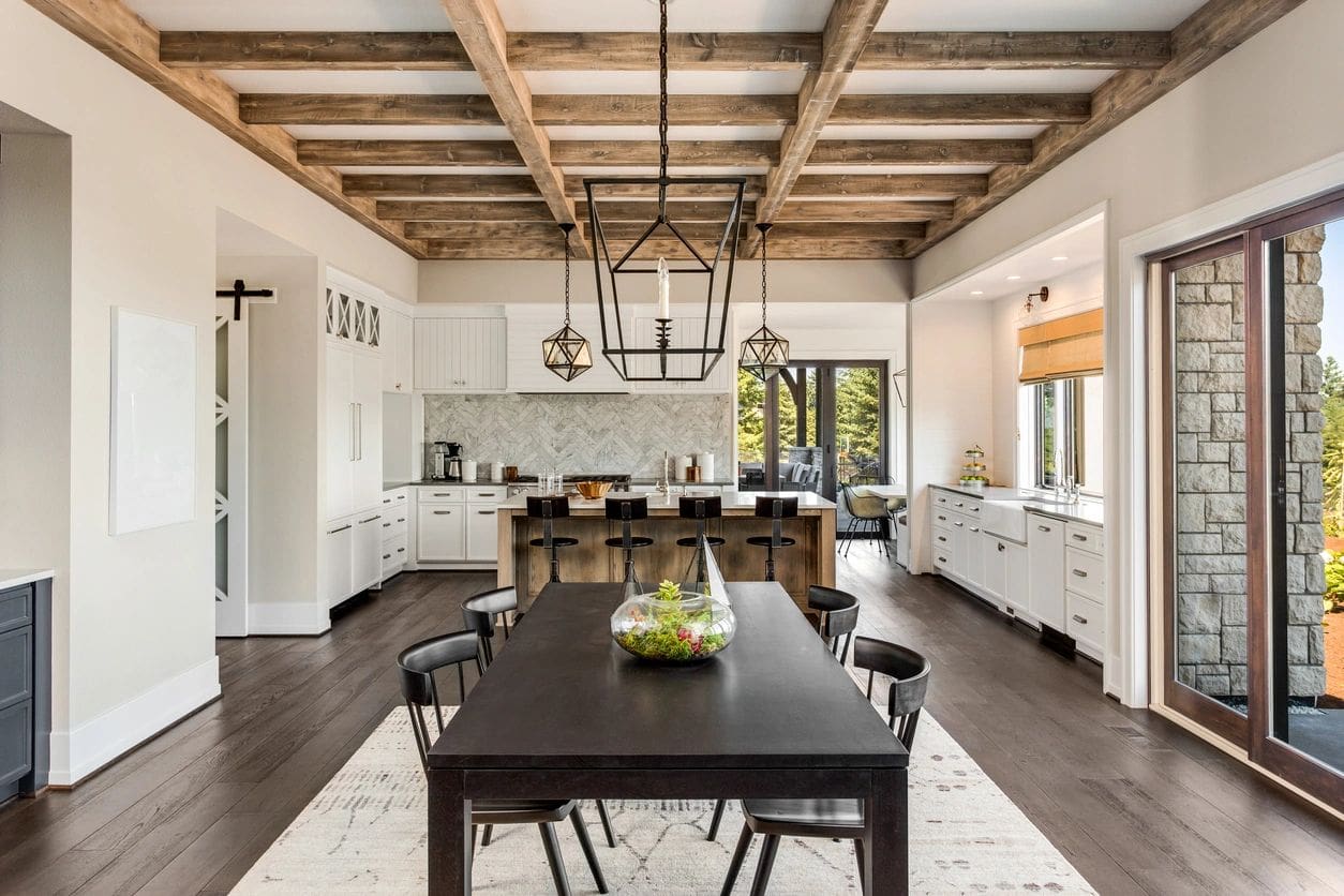 A large kitchen with a table and chairs